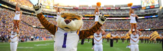 LSU Mascot and cheerleaders working the crowd at a game