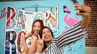 Selfie in front of the Visit Baton Rouge mural