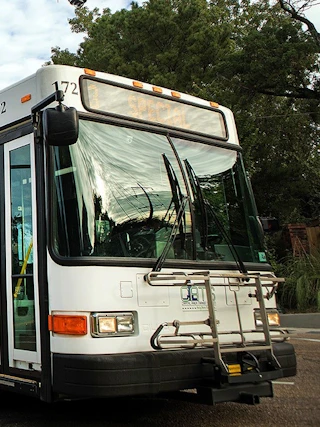 A CATS (Capital Area Transit System) bus driving down the street in Baton Rouge, LA