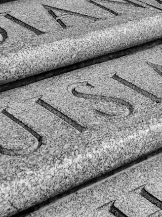 Close up of Louisiana text carved in granite at State Capitol