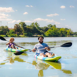 two people kayaking on LSU Lakes